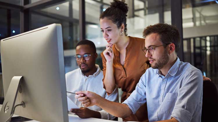 Three People engaging in IT training